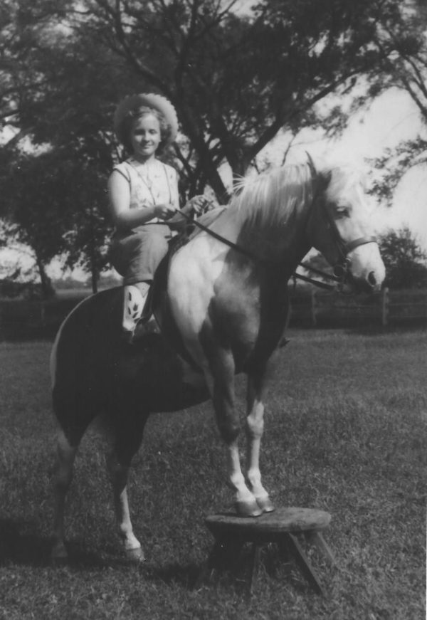 child riding misty of chincoteague