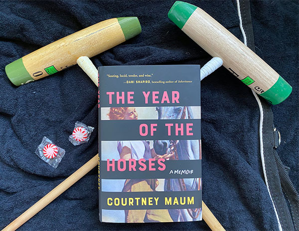 the year of the horses book rests atop two polo mallets