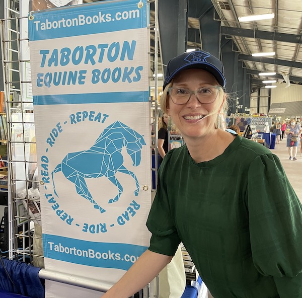 Taborton Equine Books sign with author Susan Friedland at Breyerfest