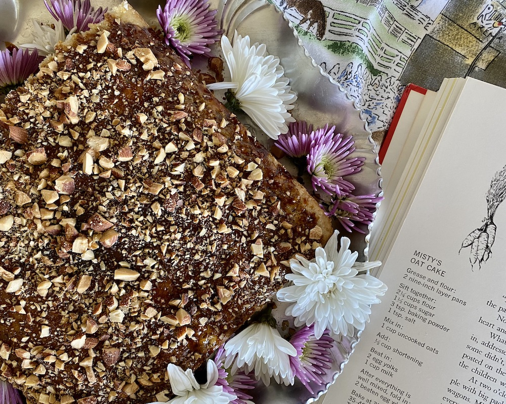 Misty of Chincoteague Oat Cake horse birthday cake with molasses on a platter with flowers