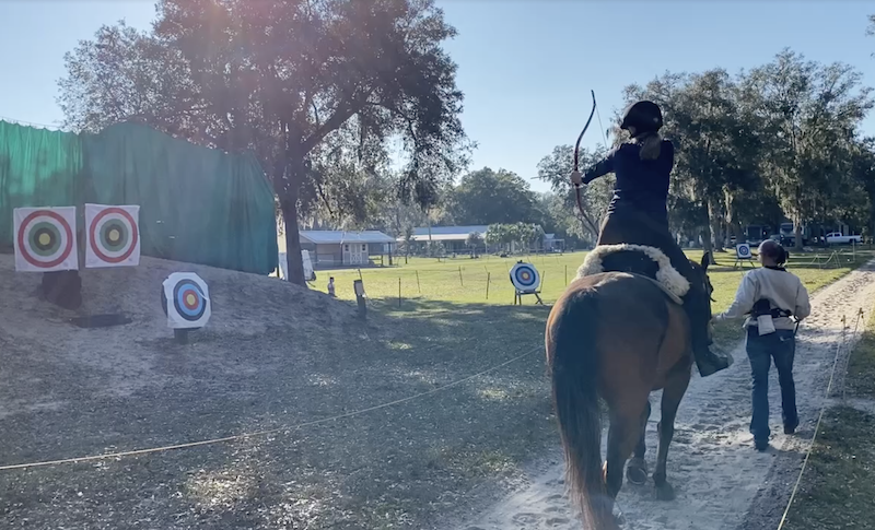 mounted archer aiming at targets
